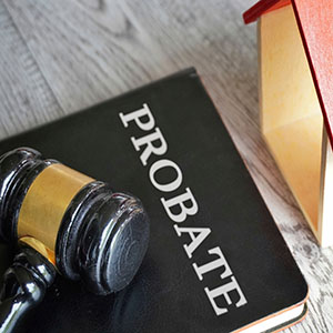 Gavel on a book labeled PROBATE, illustrating legal strategies for avoiding probate in New York estate law.