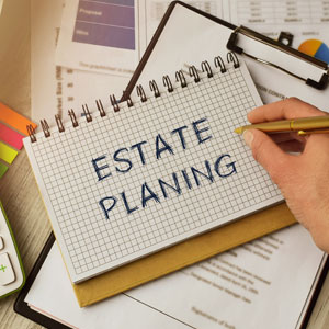 Notepad labeled 'Estate Planning' and documents, representing estate planning process. - Hyl Conte Law, PLLC